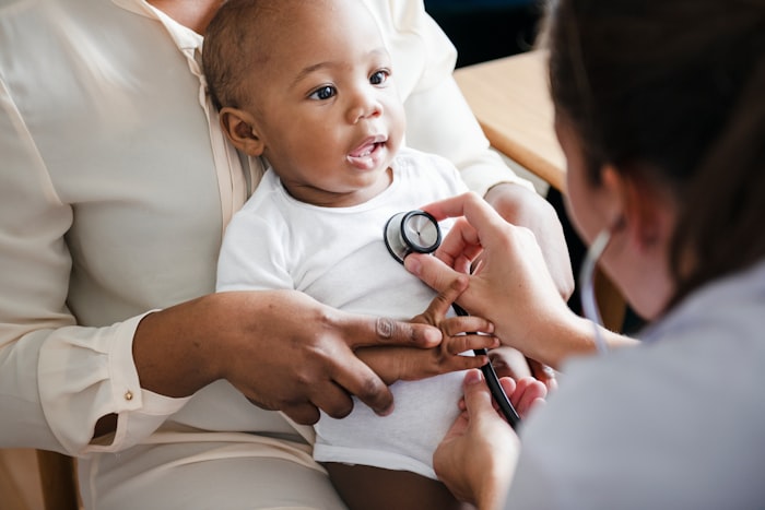 Doctor checking a baby with a stethoscope